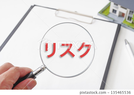 Real estate documents and a magnifying glass 135465536