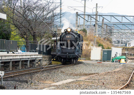 Steam locomotive running with smoke Steam locomotive running with smoke 135467569