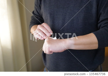 Man applying hand cream 2 135467736