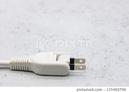 Power plug on a gray background Power plug on a gray background 135468798