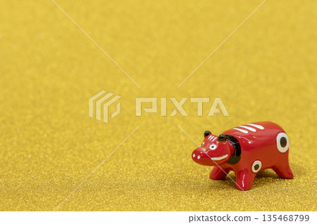 Akabeko on a gold background Akabeko on a gold background 135468799