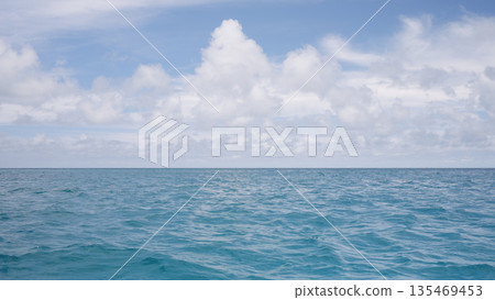 Side view from boat in Indian ocean sailing between Seychelles islands in daytime 135469453