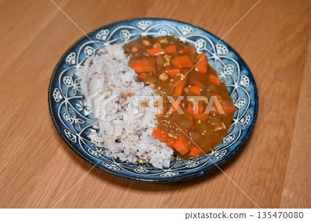 Homemade curry with plenty of carrots Homemade curry with plenty of carrots 135470080