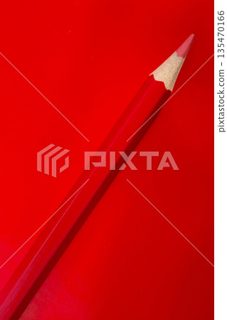 Red pencil on a red background Red pencil on a red background 135470166