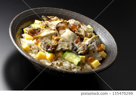 Oyster chirashi sushi photographed against a black background Oyster chirashi sushi photographed against a black background 135470299