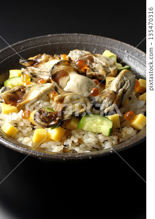 Oyster chirashi sushi photographed against a black background 135470316