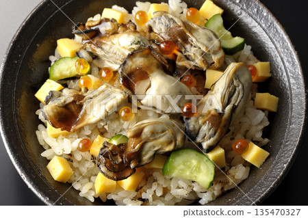Oyster chirashi sushi photographed against a black background Oyster chirashi sushi photographed against a black background 135470327