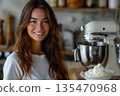 Smiling Woman Holding Large Bowl Of Cream 135470968