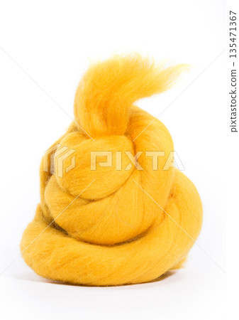 Hank merino wool of yellow color on a white background 135471367