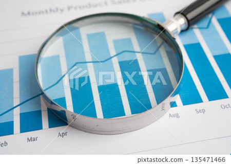 Magnifying glass on charts graphs paper. Financial development, Banking Account, Statistic, Investment Analytic research data economy. Magnifying glass on charts graphs paper. Financial development, Banking Account, Statistic, Investment Analytic research data economy. 135471466