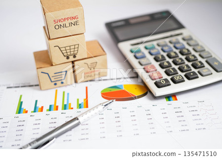 Online shopping, Shopping cart box on business graph, import export, finance commerce. 135471510