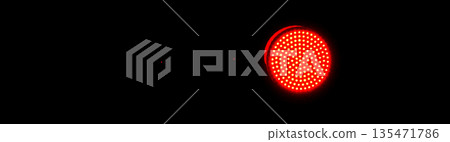 Red flashing signal of a crossing gate glowing in the dark Red flashing signal of a crossing gate glowing in the dark 135471786