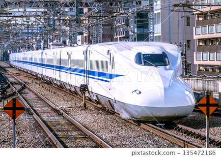 Yokohama cityscape in Japan: Inbound tourism continues... View of the Shinkansen (N700A, front car) approaching Shin-Yokohama Station Yokohama cityscape in Japan: Inbound tourism continues... View of the Shinkansen (N700A, front car) approaching Shin-Yokohama Station 135472186