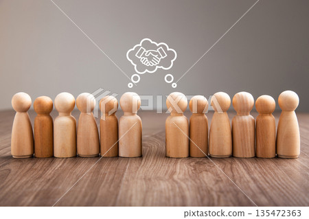 Wooden people peg dolls thinking about business partnership Wooden people peg dolls thinking about business partnership 135472363