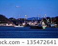 A coastal ship sailing through the Onomichi Channel under a clear blue sky 135472641