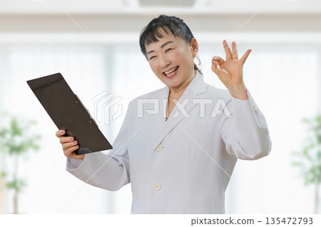 Medical woman giving an OK sign 135472793