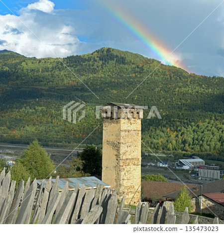 View of Svan towers against the rainbow in Mestia, Georgia, Svaneti. 135473023
