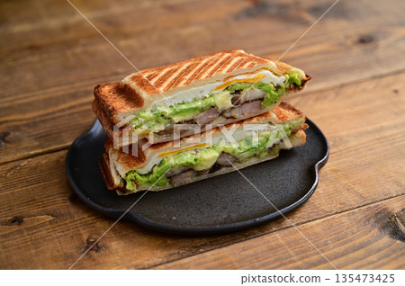 Broad bean, cheese and roasted pork hot sandwich 135473425