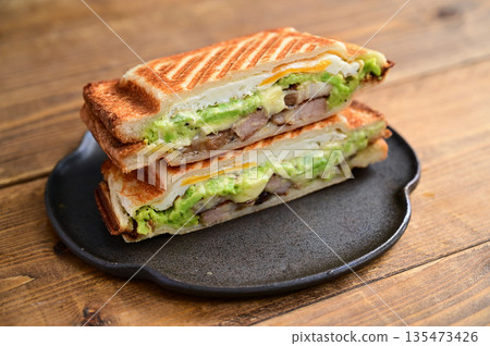 Broad bean, cheese and roasted pork hot sandwich Broad bean, cheese and roasted pork hot sandwich 135473426