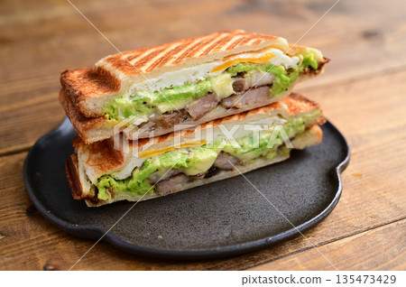 Broad bean, cheese and roasted pork hot sandwich Broad bean, cheese and roasted pork hot sandwich 135473429