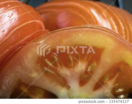 Detailed Shot Highlighting Tomato Seeds And Glossy Flesh Texture Detailed Shot Highlighting Tomato Seeds And Glossy Flesh Texture 135474127