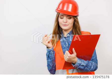 Woman engineer construction builder in helmet. Woman engineer construction builder in helmet. 135475178