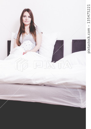 Lady in bed. 135475221