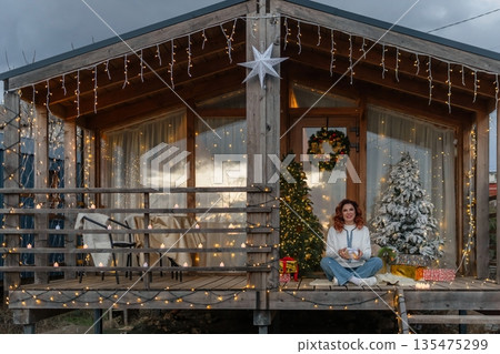 Woman Christmas Cabin Decorated Porch Holiday 135475299