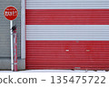 Red and white striped shutters 135475722