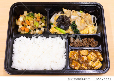 Delicious Chinese bento box with fried pork and wood ear mushroom with egg, mapo tofu, etc. 135476535