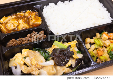 Delicious Chinese bento box with fried pork and wood ear mushroom with egg, mapo tofu, etc. Delicious Chinese bento box with fried pork and wood ear mushroom with egg, mapo tofu, etc. 135476538