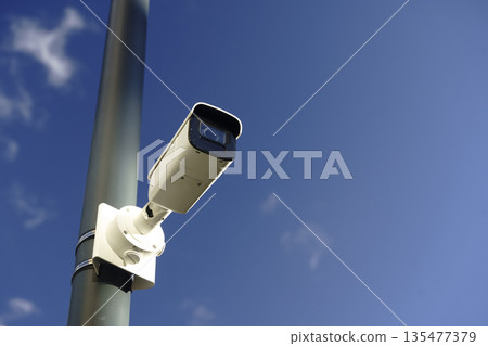 Surveillance Camera on Street Pole for Urban Security and Monitoring 135477379