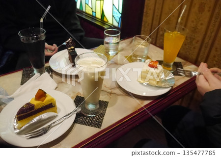 A person ordering a cake set at a retro coffee shop A person ordering a cake set at a retro coffee shop 135477785