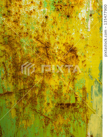 Weathered steel surface with rust and paint in industrial setting 135477900