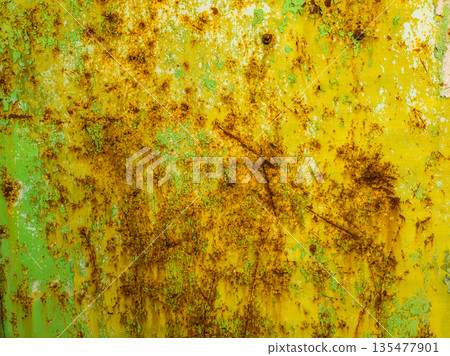 Weathered steel surface with rust and peeling paint outdoors 135477901