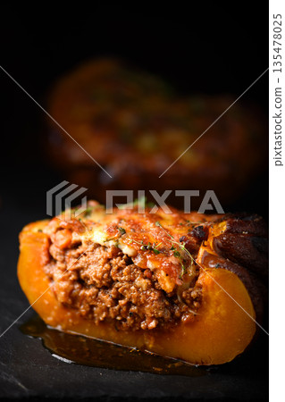 Slice of baked pumpkin with meat stuffing 135478025