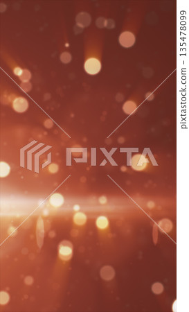 Soft warm bokeh lights and glowing rays on a reddish gradient background, creating a festive dreamy atmosphere 135478099