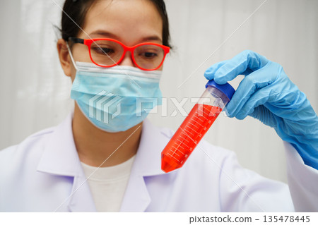 Scientist medical professional use test tube for research in science laboratory. 135478445