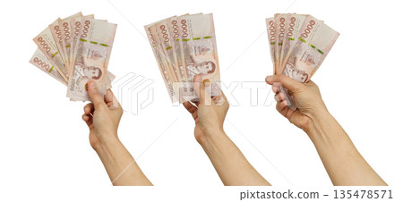 Asian woman holding mobile smartphone in hand for communication isolated on white background. Asian woman holding mobile smartphone in hand for communication isolated on white background. 135478571