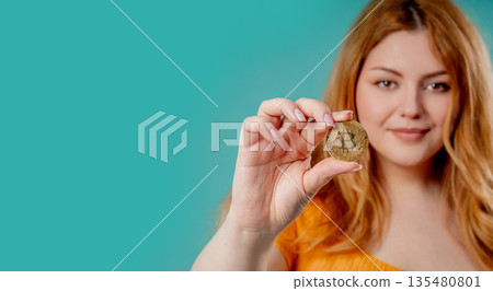 Plus Size Woman Bitcoin, Crypto Currency. Golden Coin On Blue Background. Btc Plus Size Woman Bitcoin, Crypto Currency. Golden Coin On Blue Background. Btc 135480801
