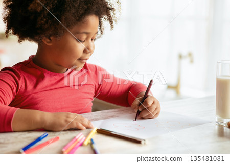 Children Development Activities. Cute Little Black Girl Drawing At Table In Kitchen, Adorable African American Female Kid Using Colorful Pencils, Having Fun At Home, Closeup Shot With Free Space 135481081