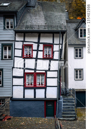 Picturesque Town Monschau with Historical Charm and the Tranquil Rur River in autumn Picturesque Town Monschau with Historical Charm and the Tranquil Rur River in autumn 135481986