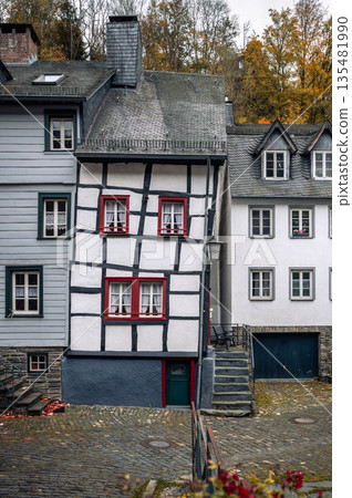 Picturesque Town Monschau with Historical Charm and the Tranquil Rur River in autumn 135481990