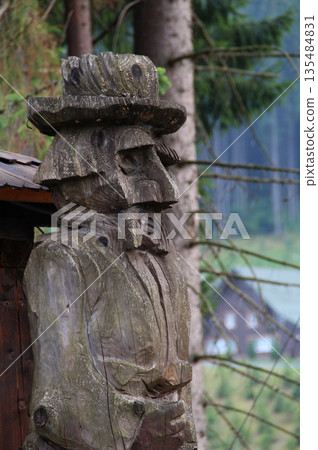 Old Male Wooden Idol Near Village Detailed Photo Old Male Wooden Idol Near Village Detailed Photo 135484831