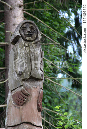 Ancient Female Wooden Idol In Forest Detailed Photo 135484862