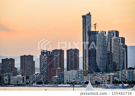 Beautiful sunset over the city of Benidorm, Valencian Community, Alicante province. Cityscape Beautiful sunset over the city of Benidorm, Valencian Community, Alicante province. Cityscape 135485716