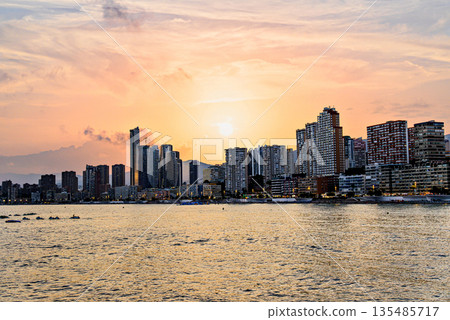 Beautiful sunset over the city of Benidorm, Valencian Community, Alicante province. Cityscape 135485717