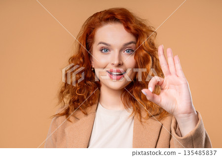 Positive woman forms OK, OKay hand sign, smiling confident. Confirmation,success Positive woman forms OK, OKay hand sign, smiling confident. Confirmation,success 135485837