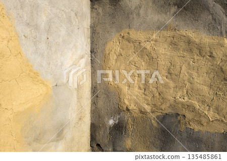Rustic textured concrete inner corner between walls with colorful cracks outdoors Rustic textured concrete inner corner between walls with colorful cracks outdoors 135485861