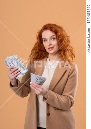 Rich Businesswoman With Usd Cash Money Dollars On Beige, Income Payment Rich Businesswoman With Usd Cash Money Dollars On Beige, Income Payment 135485862